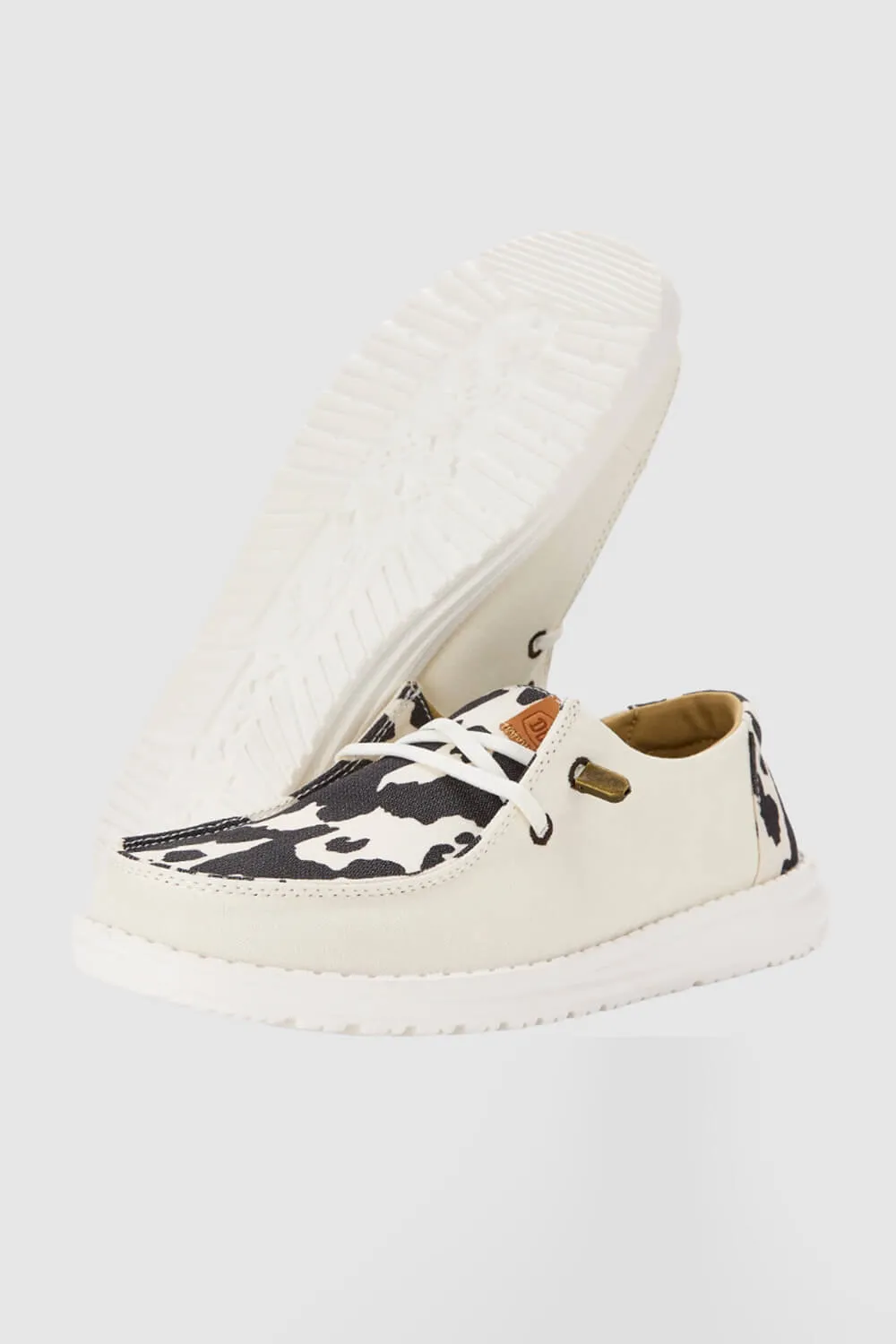 HEYDUDE Women’s Wendy Cow Print Shoes in White/Black | 41037-11G