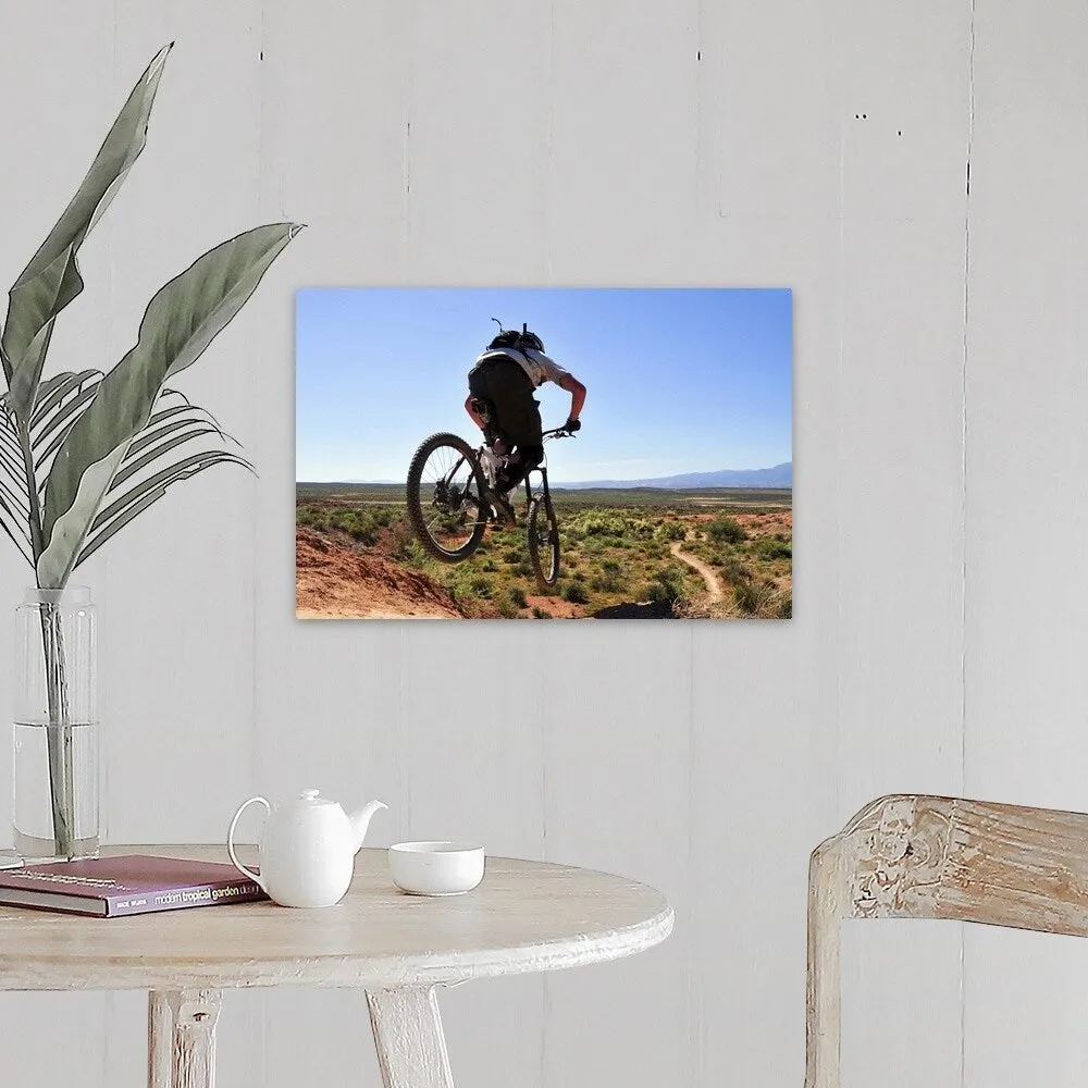 "A mountain biker catches some air on the JEM trail in southern Utah." Canvas Wall Art