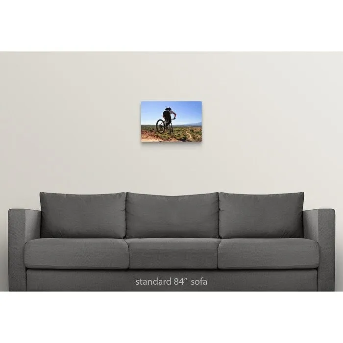 "A mountain biker catches some air on the JEM trail in southern Utah." Canvas Wall Art