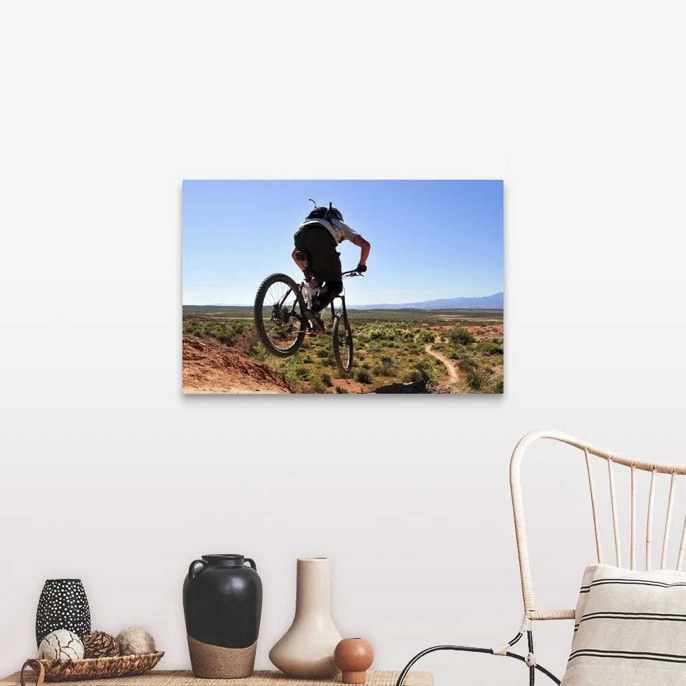 "A mountain biker catches some air on the JEM trail in southern Utah." Canvas Wall Art