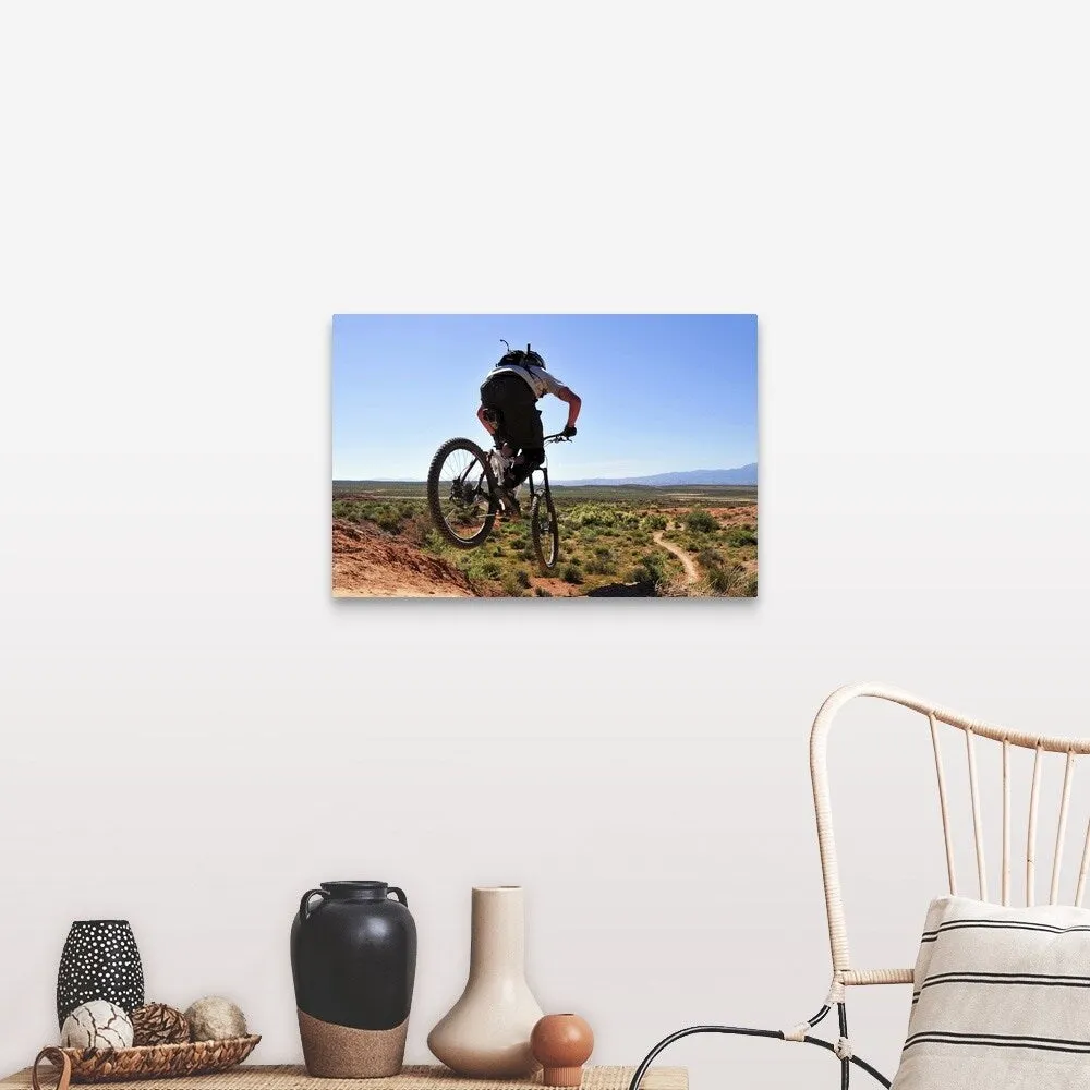 "A mountain biker catches some air on the JEM trail in southern Utah." Canvas Wall Art