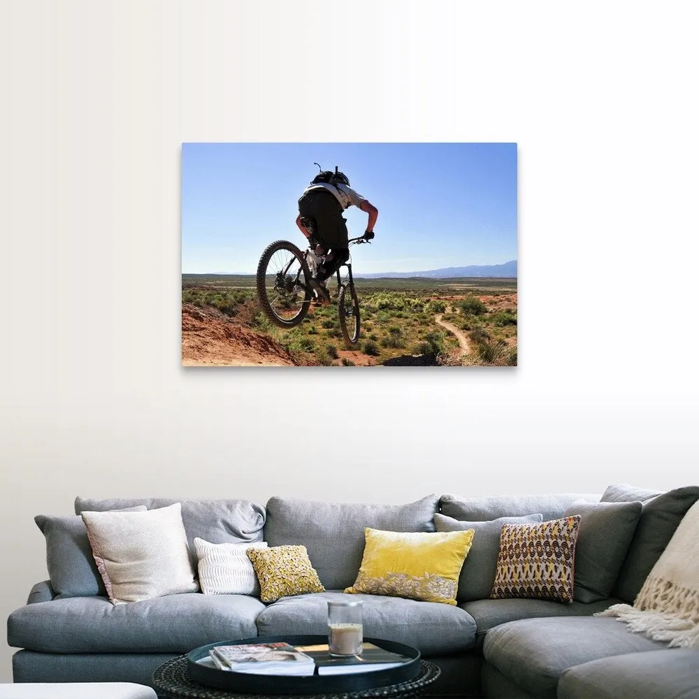 "A mountain biker catches some air on the JEM trail in southern Utah." Canvas Wall Art