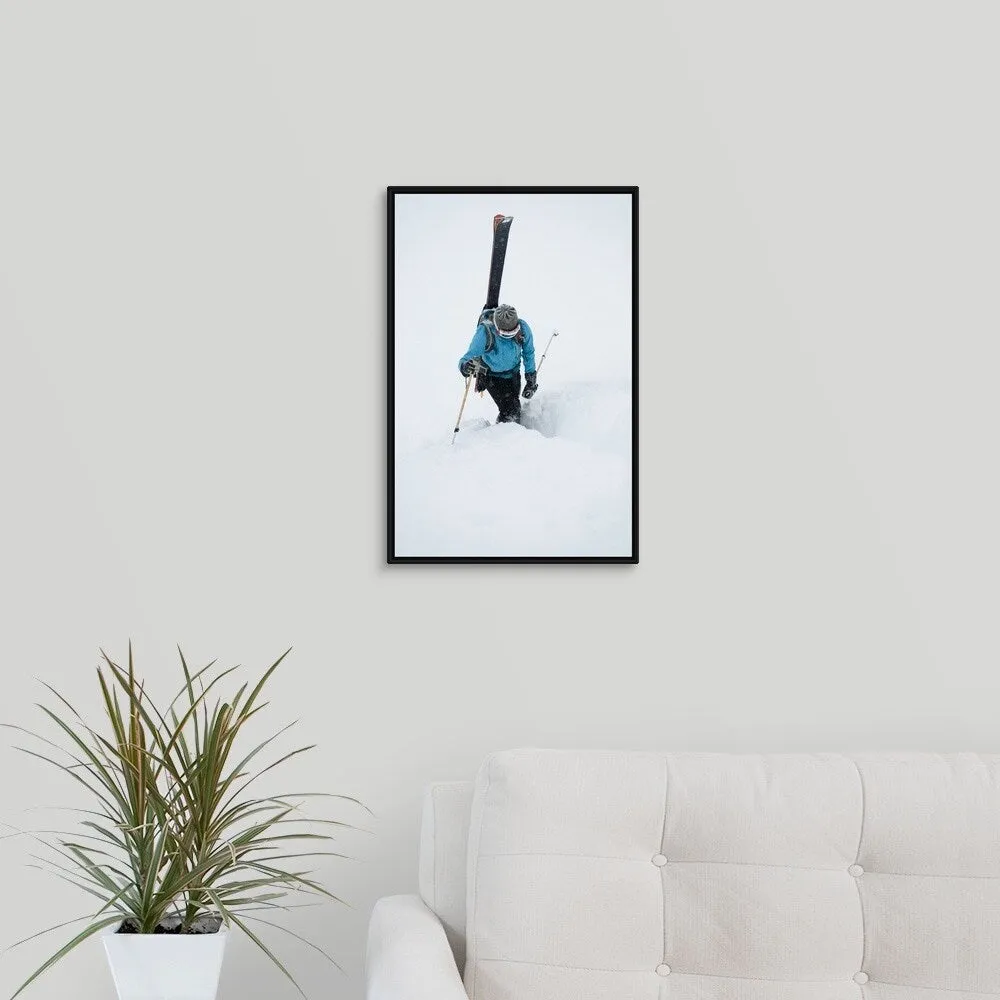 "A young woman packs her skis and kick steps up a section of trail" Black Float Frame Canvas Art