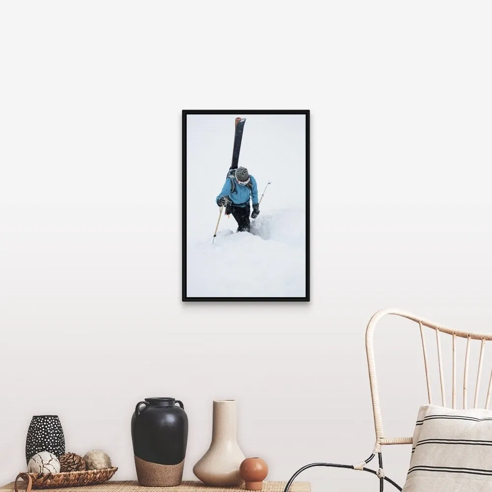 "A young woman packs her skis and kick steps up a section of trail" Black Float Frame Canvas Art