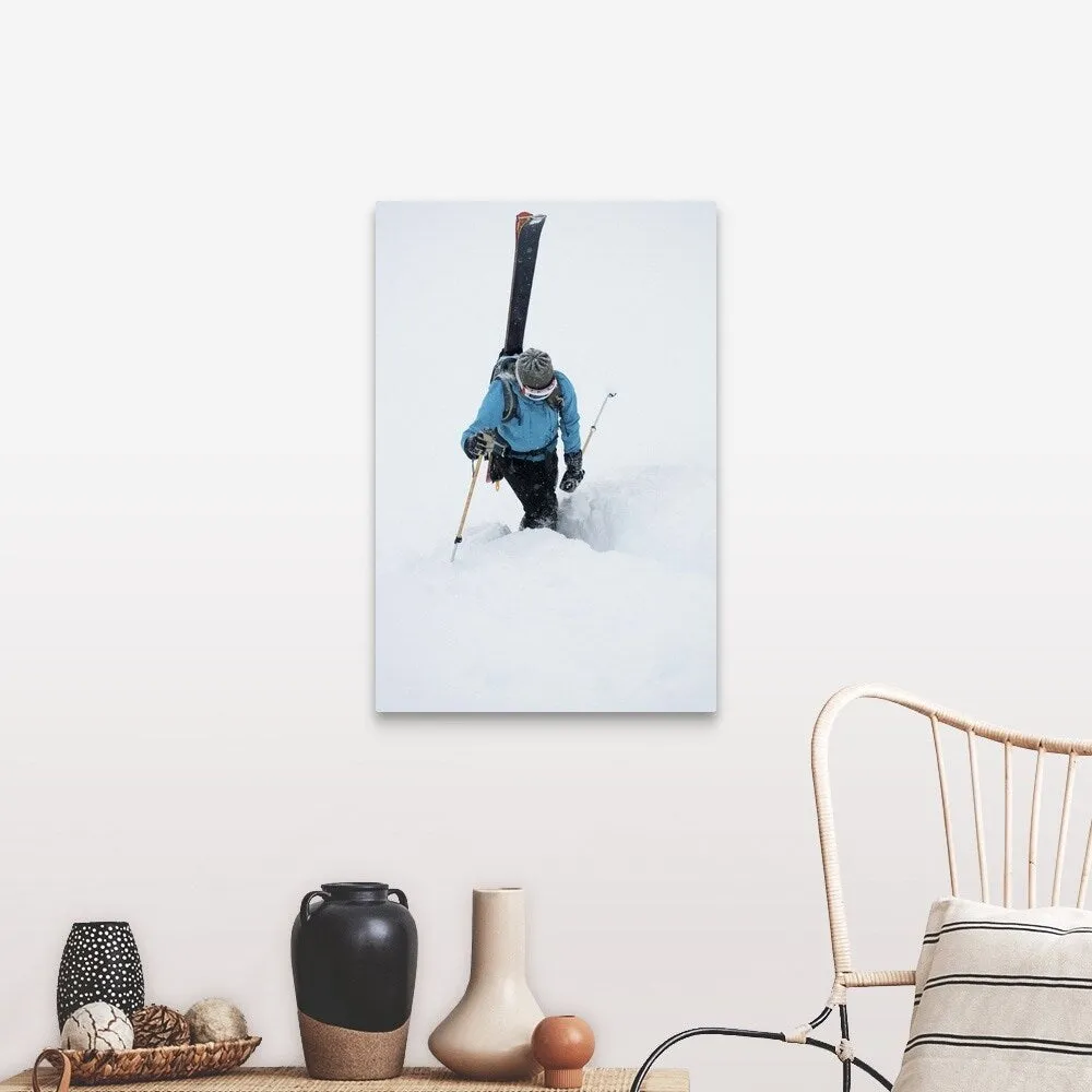 "A young woman packs her skis and kick steps up a section of trail" Canvas Wall Art