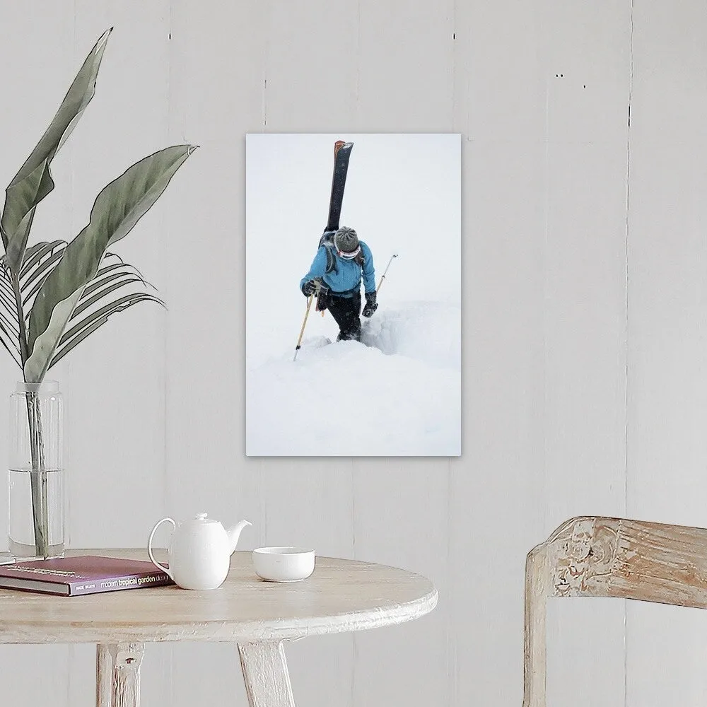 "A young woman packs her skis and kick steps up a section of trail" Canvas Wall Art